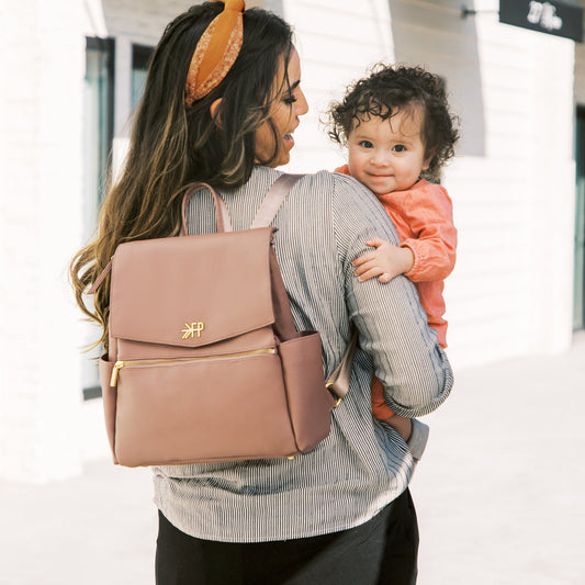 Mom with Freshly Picked Heather Mini Classic II vegan leather diaper bag backpack with eight pockets