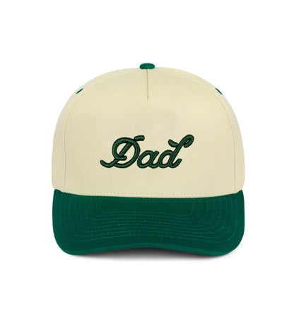 Cream Dad Snapback Hat with forest green brim and 3D puff embroidered “Dad” logo — 5-panel structured cap.