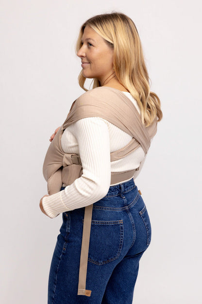 Mom wearing WildBird Desert Lark Newborn Buckle Wrap front carry CloudBlend fabric