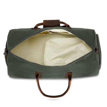 Green duffel bag with brown handles on a white background