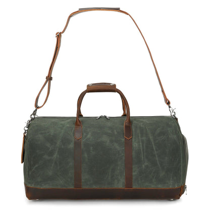 Green duffel bag with brown leather straps on a white background