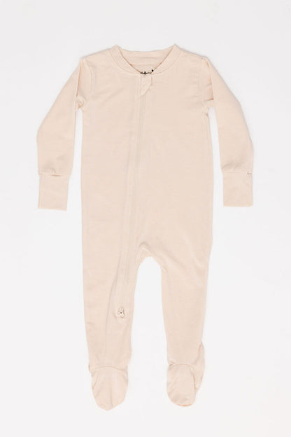 Beige baby onesie with feet on a white background