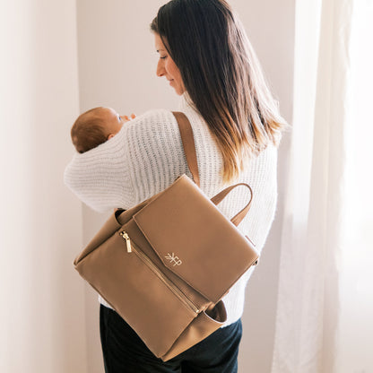 Mom with the Toffee vegan leather mini diaper bag backpack with multiple pockets by Freshly Picked