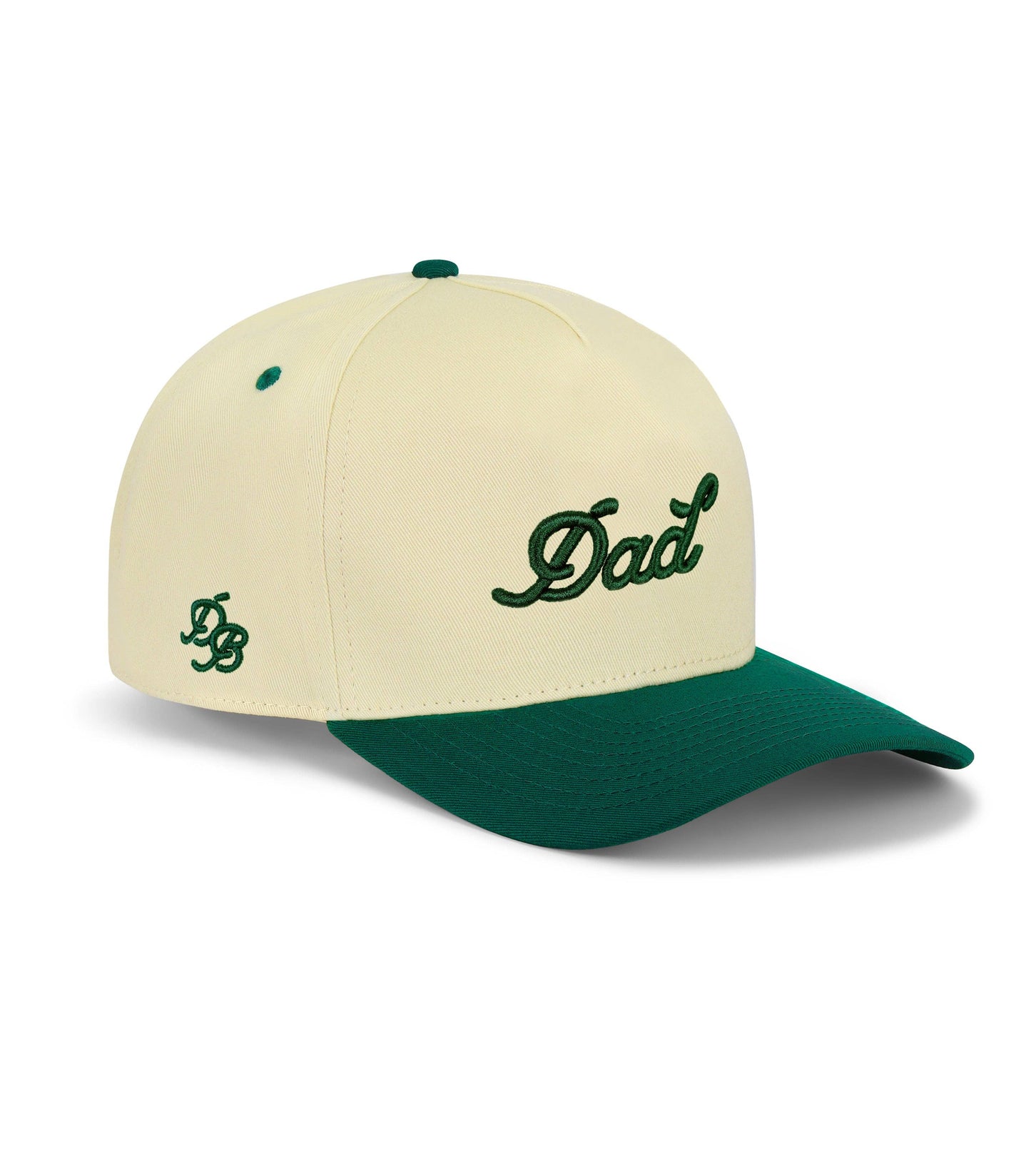 Cream Dad Snapback Hat with forest green brim and 3D puff embroidered “Dad” logo — 5-panel structured cap.