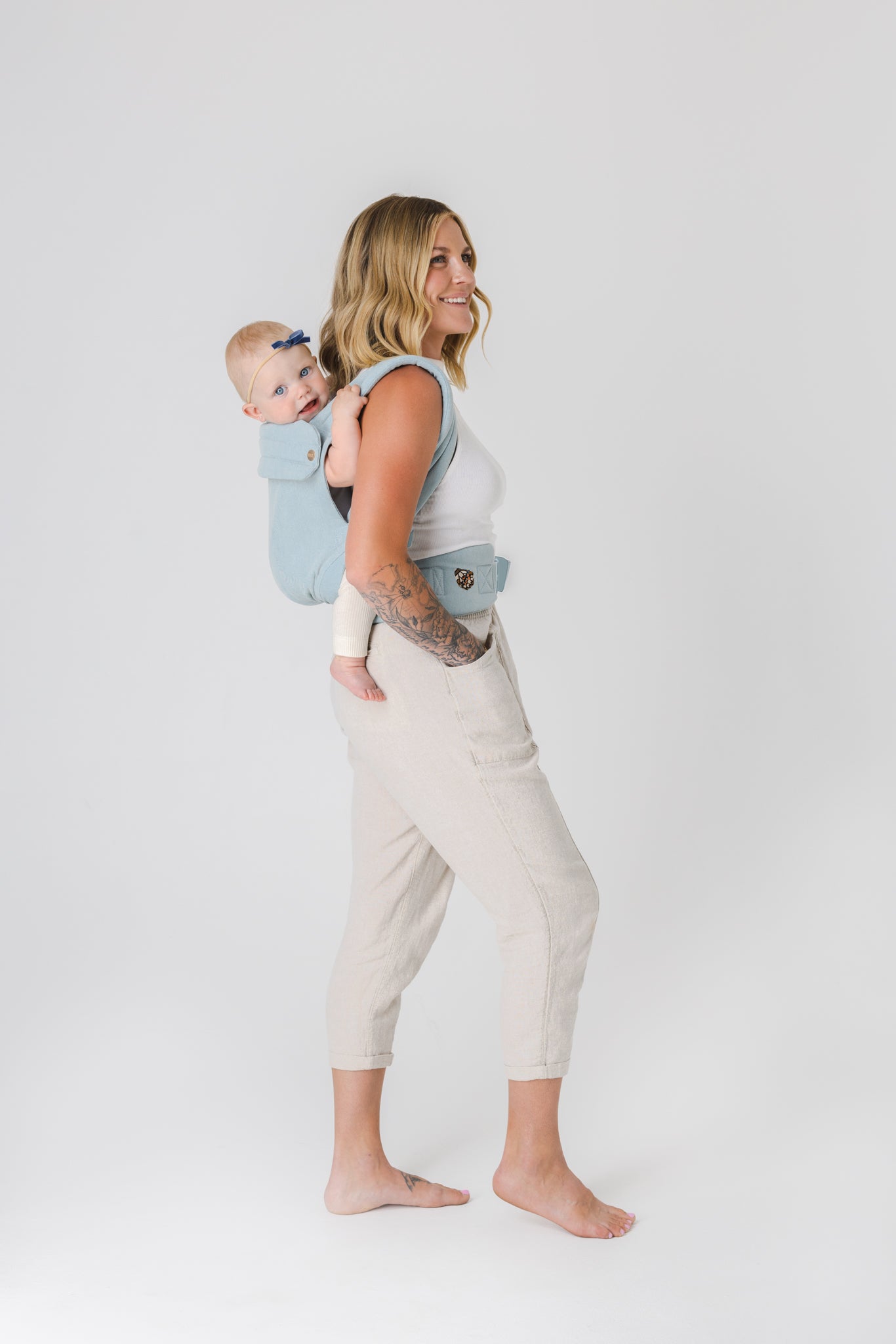 Woman carrying baby in baby carrier