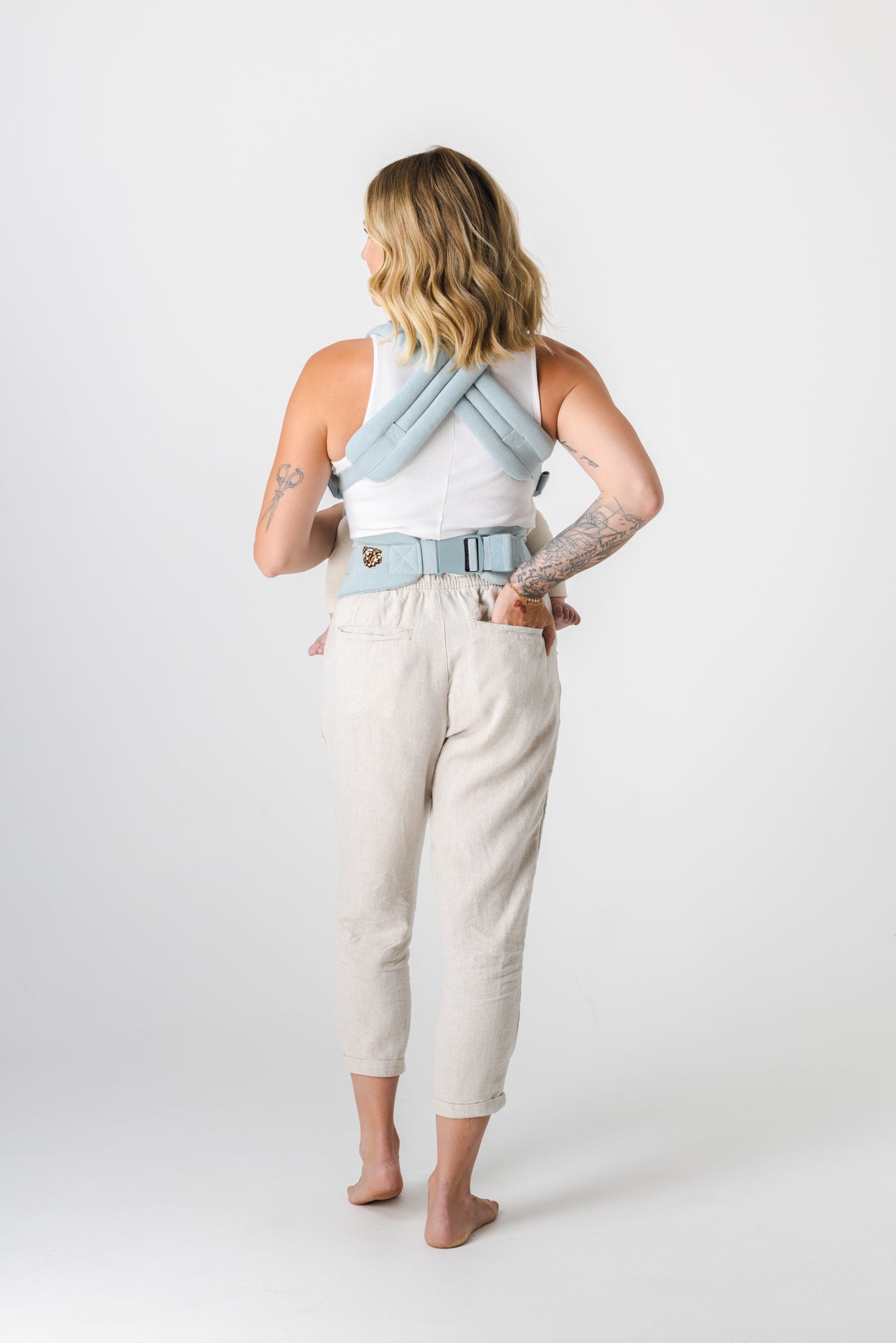 Woman carrying baby in baby carrier