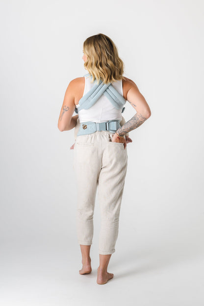 Woman carrying baby in baby carrier