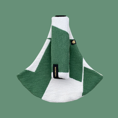 Wildride USA foldable toddler hip carrier in bold green graphic pattern